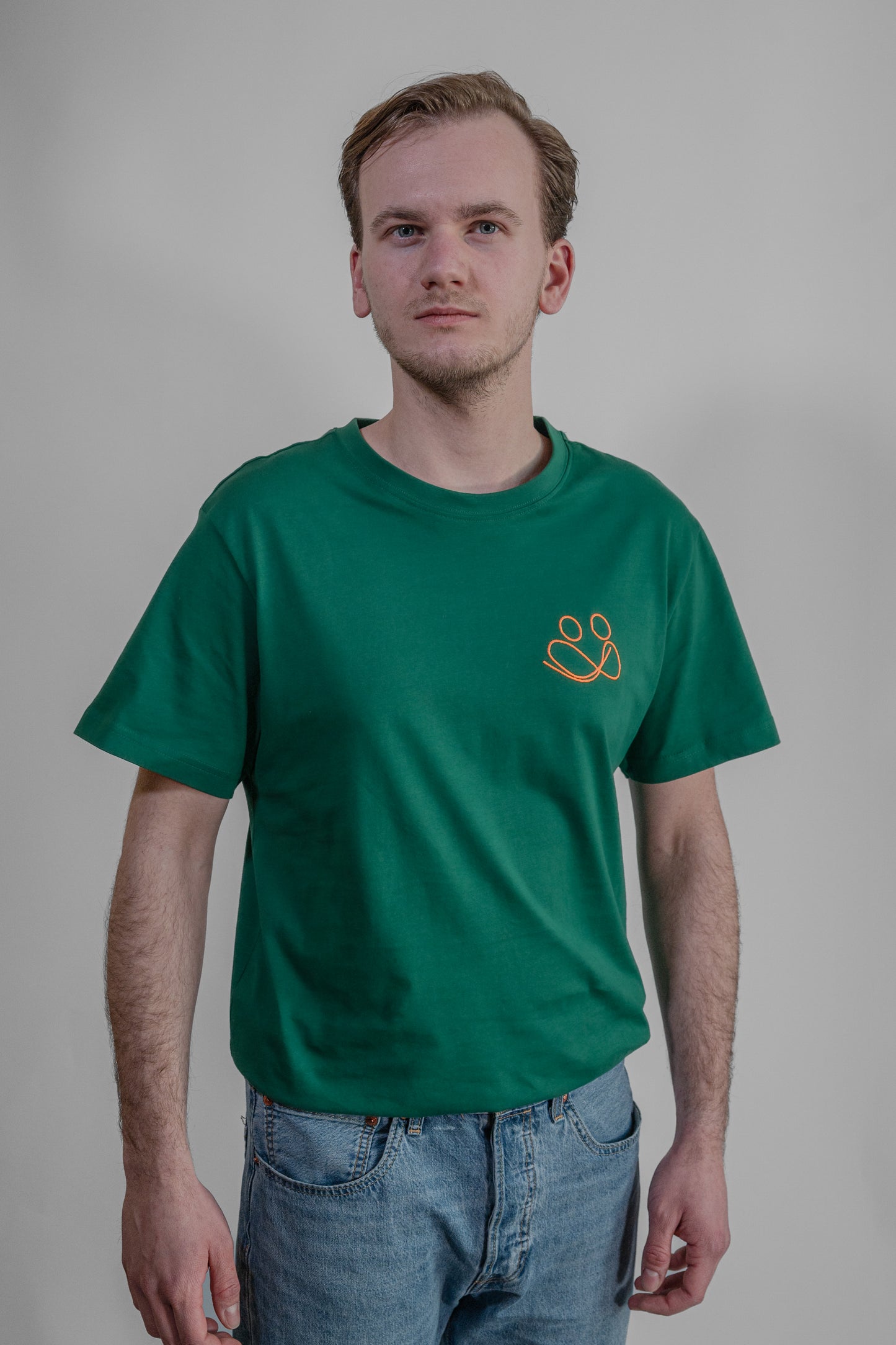 green T-shirt with orange embroidery
