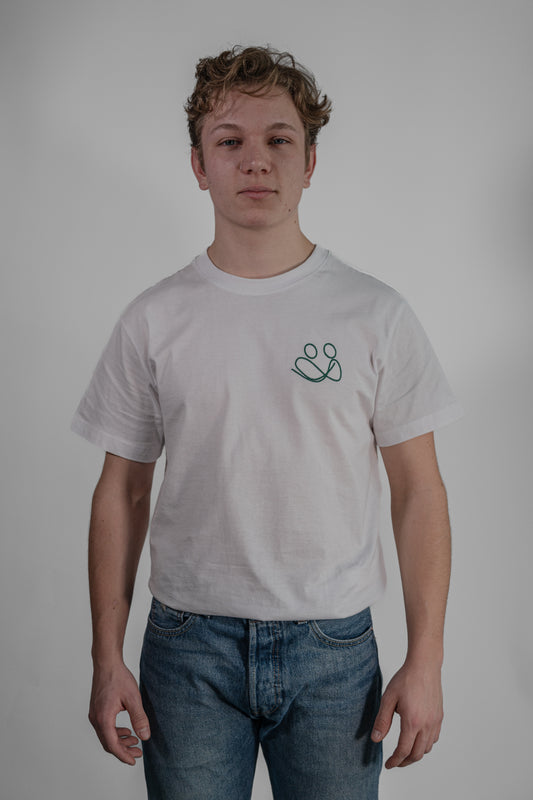 white T-shirt with green embroidery