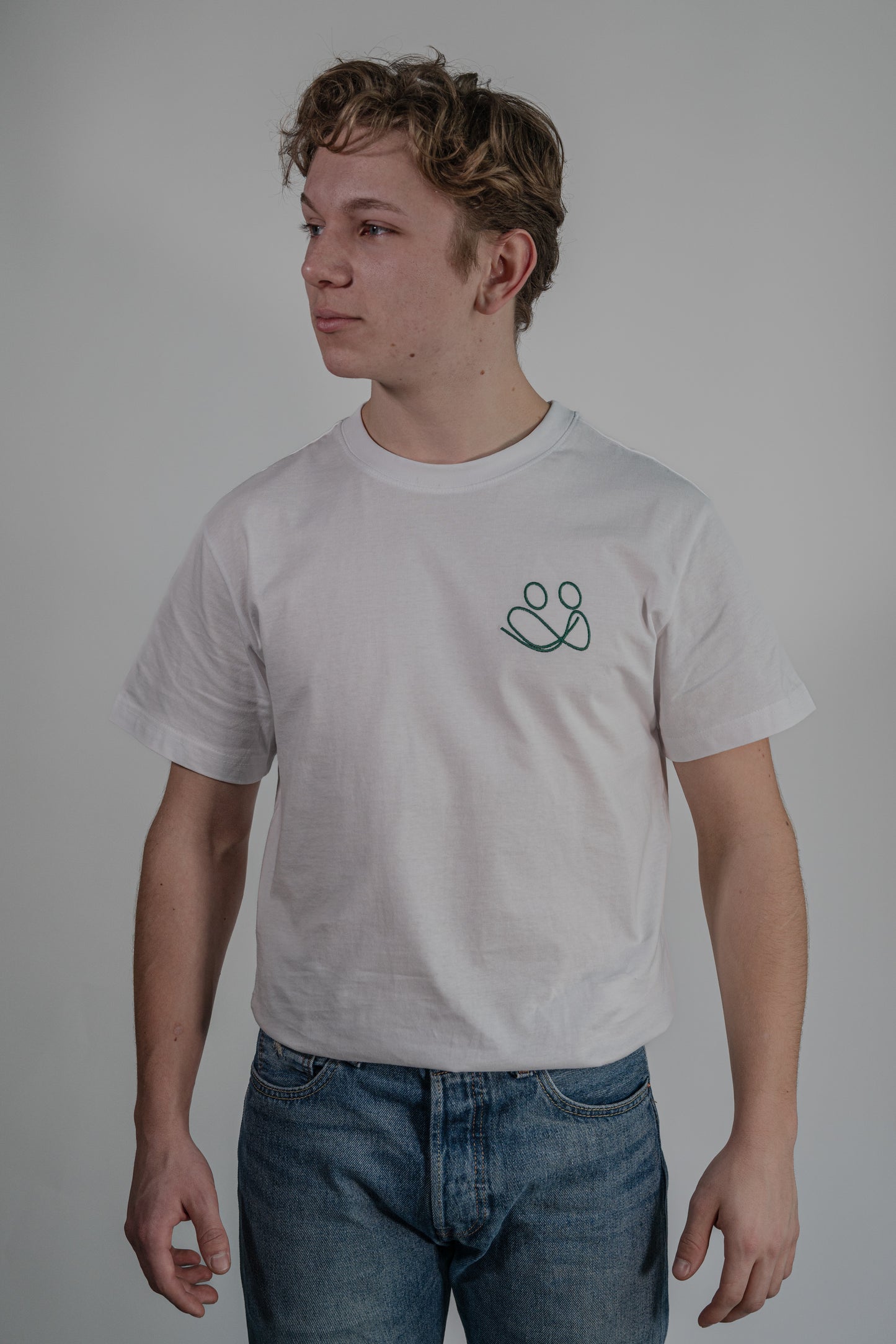 white T-shirt with green embroidery