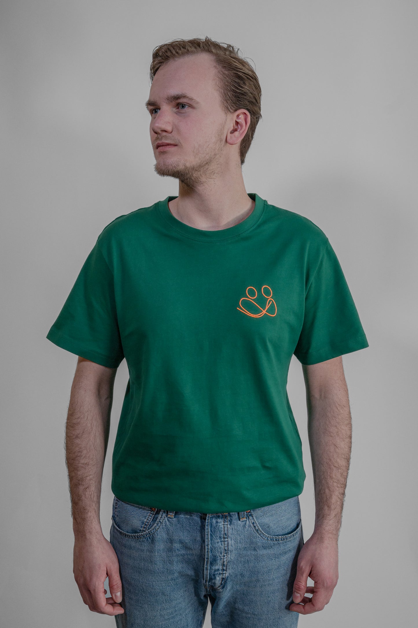 green T-shirt with orange embroidery